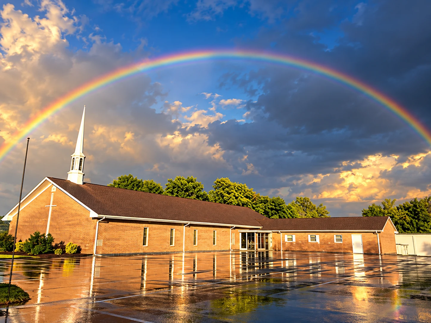 Victory Baptist Church in Mount Airy beneath a rainbow after rainfall